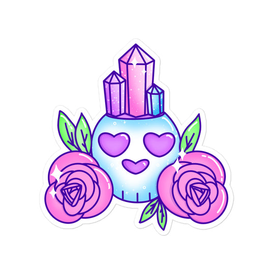 blue skull with crystals in the top of its head with pink roses on either side 
