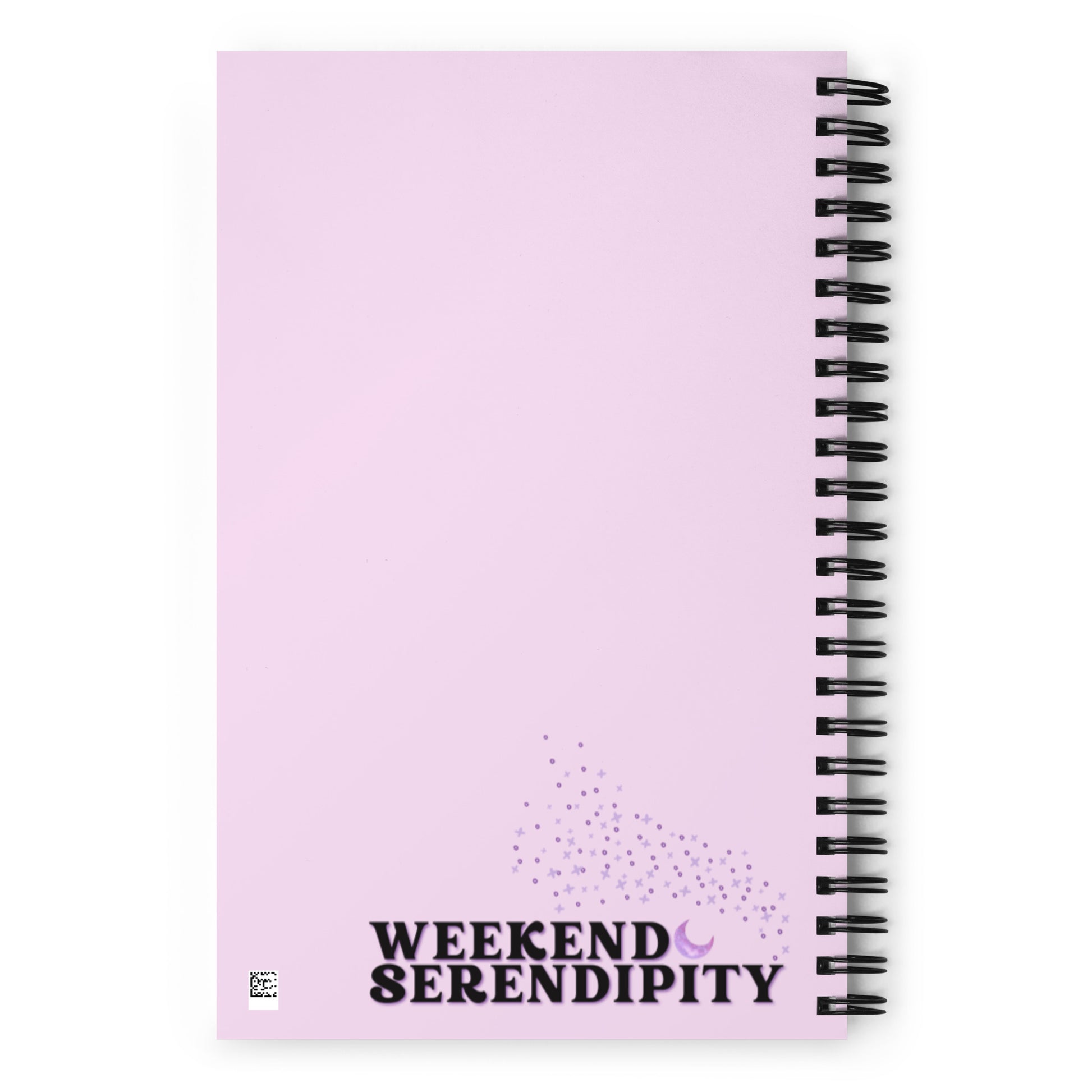 back side of a spiral bound notebook with the Weekend Serendipity logo