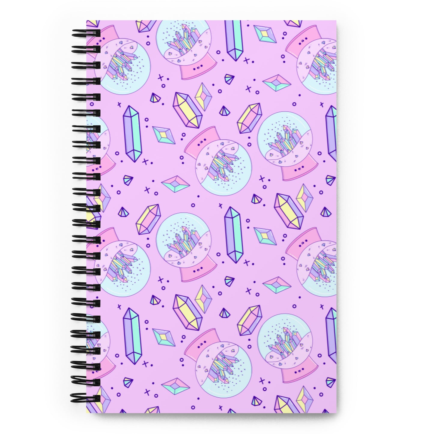 spiral bound dot grid notebook with crystals and a crystal ball filled with crystals